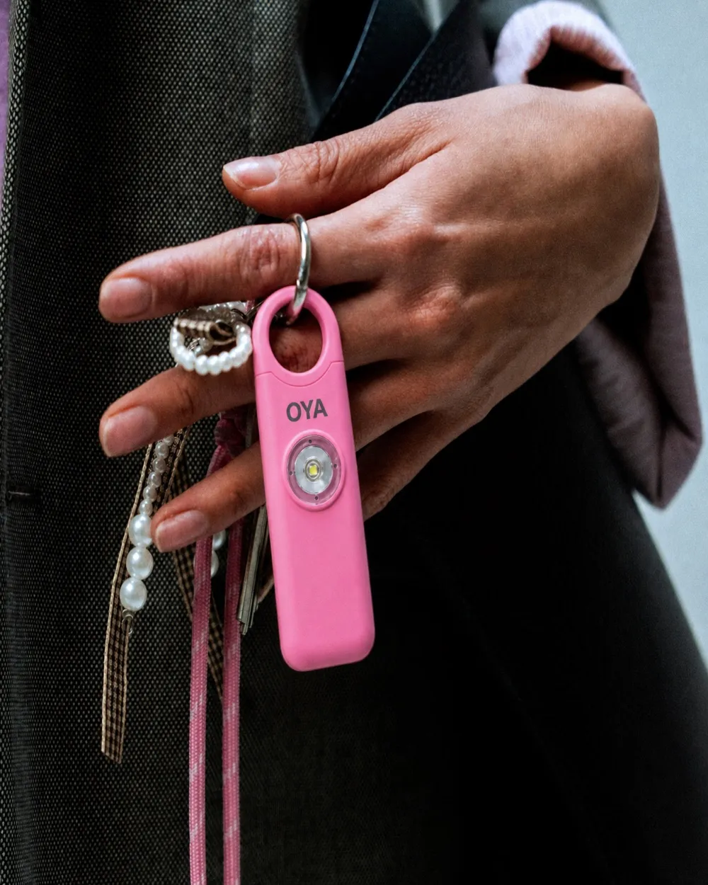 Lifestyle: OYA held in a hand, square