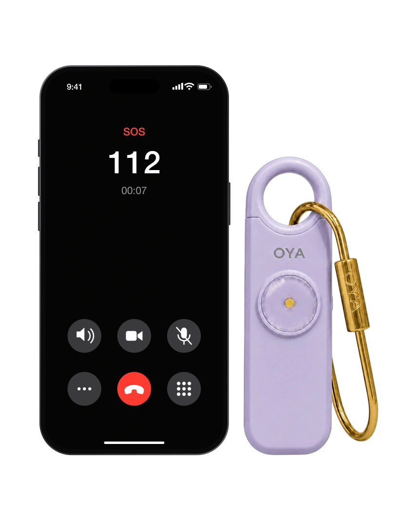 OYA Lilac Mist, Anti-agression, sirène 130 dB et lampe, à côté d’un téléphone qui appelle les secours