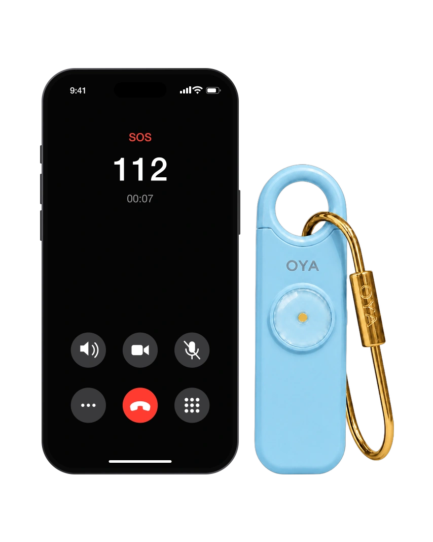 OYA Sky Blue, Anti-agression, sirène 130 dB et lampe, à côté d’un téléphone qui appelle les secours